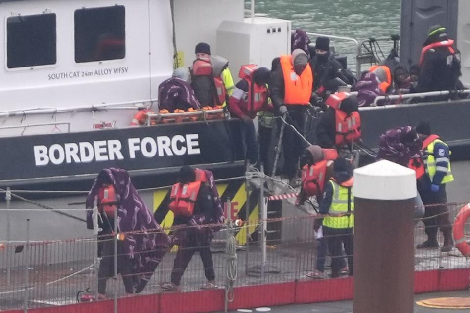 A group of people who are migrants are brought in to Dover, knows, from a border weather vessel after a small boot incident in the canal (Gareth Fuller/PA) (PA thread)