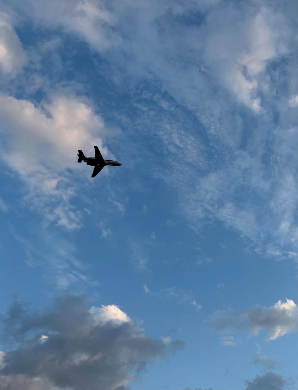 A plane flies out of Naples Airport on December 23, 2024. The public airport, located in the middle of one of the wealthiest cities in the US, has been in the same location since 1943, when it was used as a military airfield.