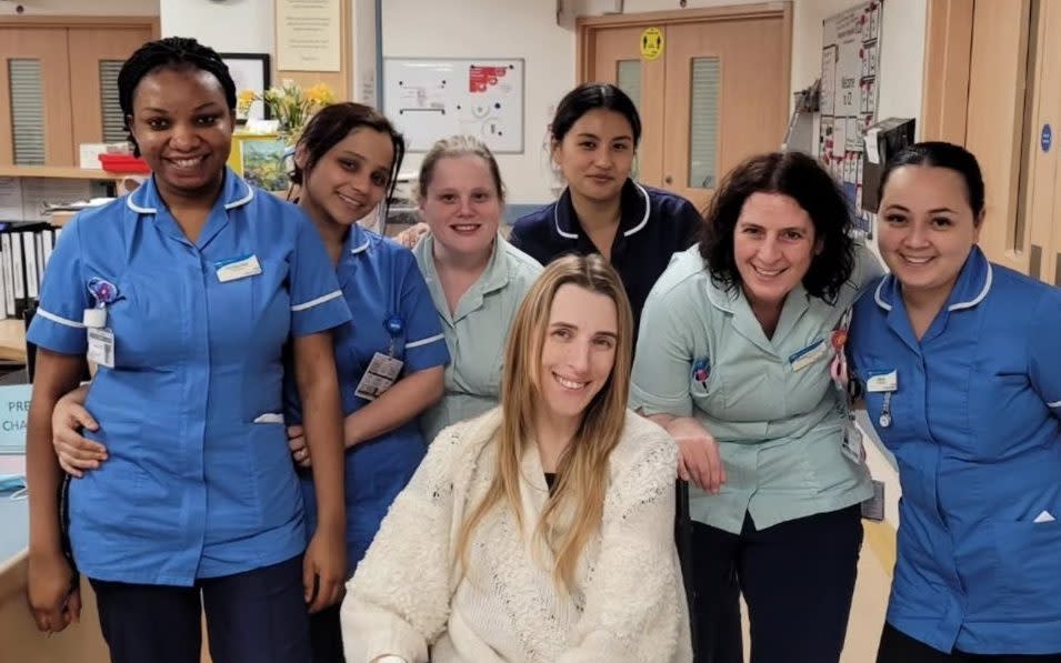 Faye Louise with hospital staff after her surgery