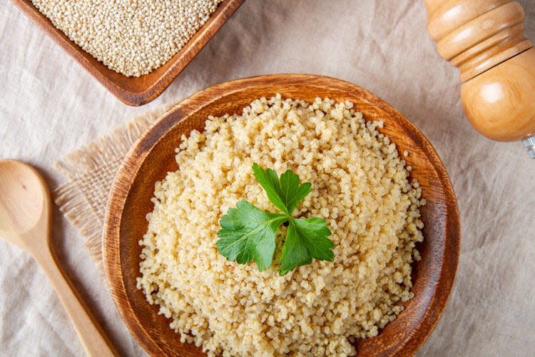 Cooked quinoa in a wooden bowl