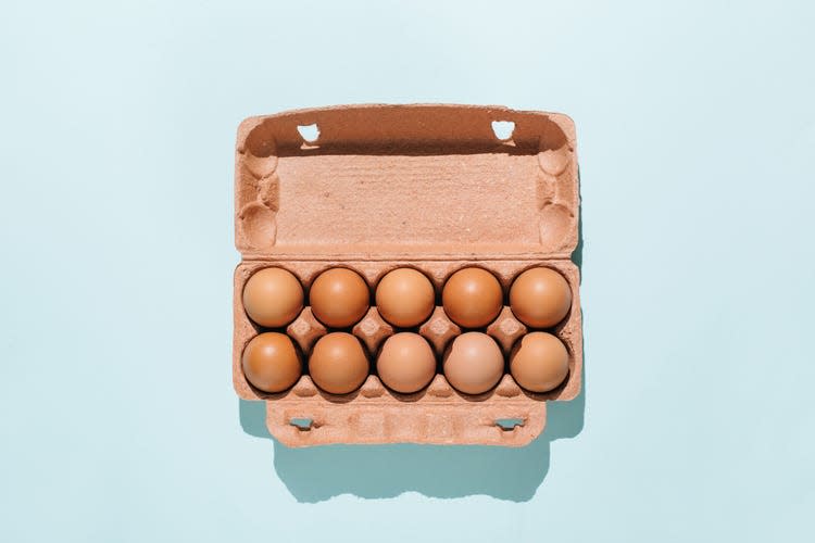 A box full of brown eggs