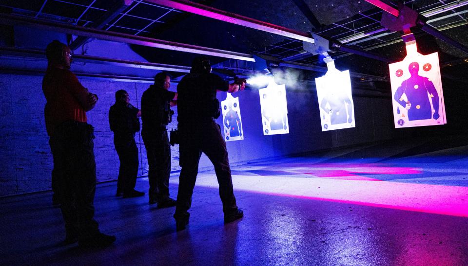 Police officers from Naples from front to back, Lt. Bryan McGinn, Sgt. Benjamin Vasquez and master officer Reyes train on the fire range in the Alamo by Lotus Gunworks in Naples on Monday, January 13, 2025. They were firewapentraining with the implementation of Nachtvizien. In the foreground is firearm instructor, Jacob Christenson. Not shown are sgt. Mike Harmeling, a reach instructor and Lt. Seth Finman, coordinator of firearms. They are all police officers in Naples.