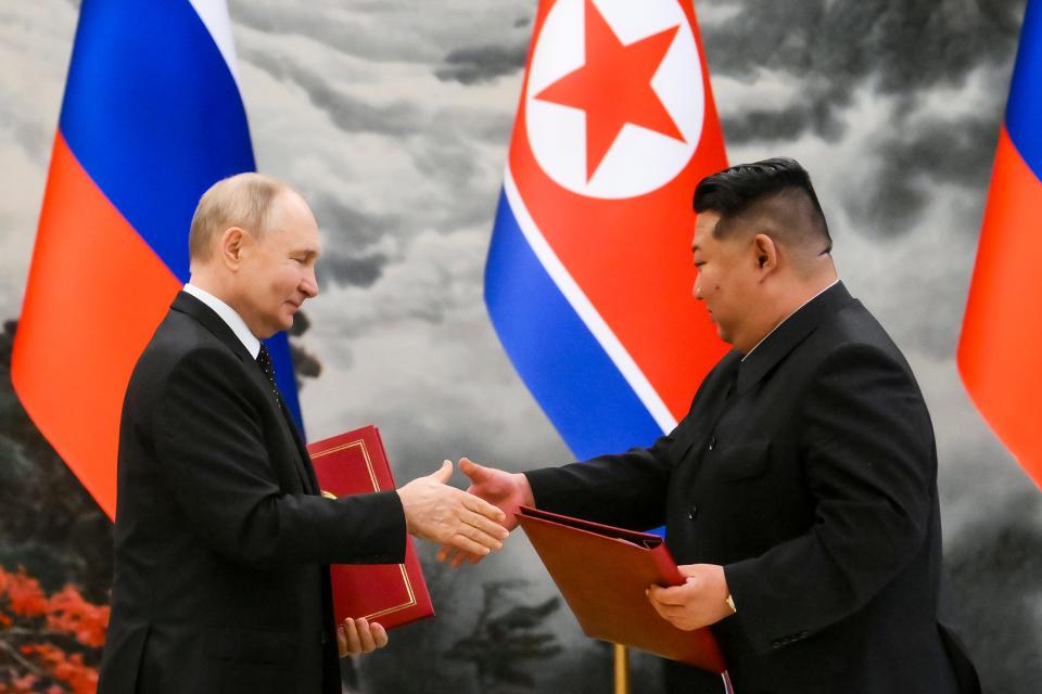 Russian President Vladimir Putin and the North Korean leader Kim Jong Un documents during a signing ceremony of a new partnership in Pyongyang on 19 June.