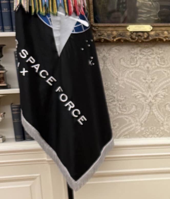 Space Force Flag displayed in a formal room with books and artworks in the background