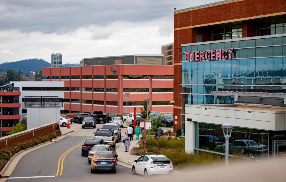 Residents of Asheville are in the lines outside the first aid at Mission Health after Tropical Storm Helene hit the region.