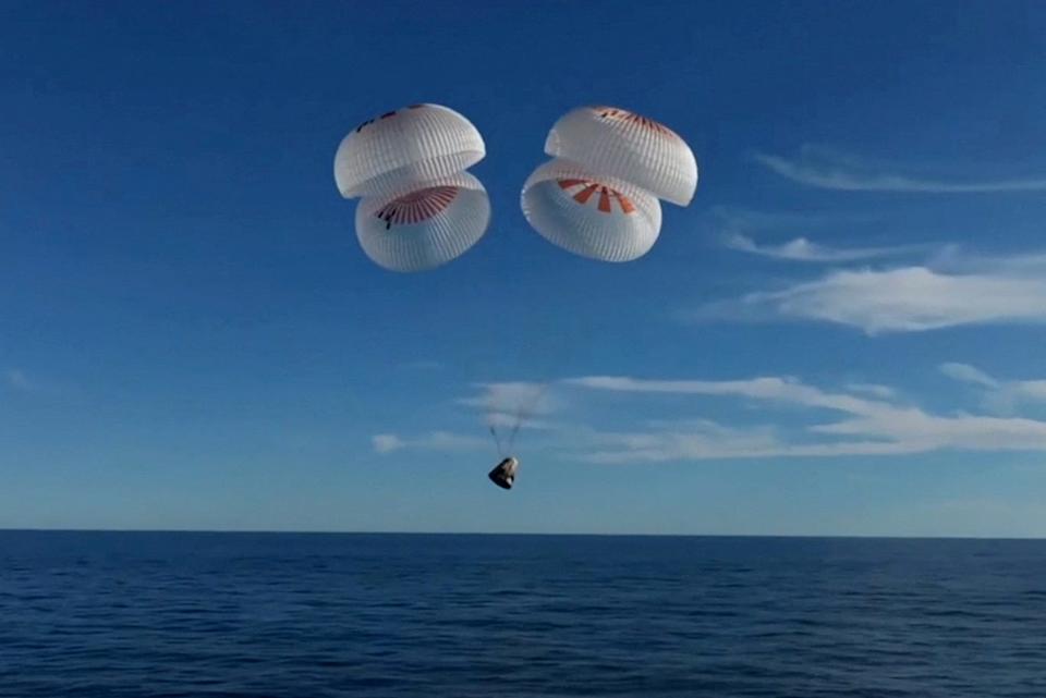 The Crew Dragon Capsule with Butch Wilmore and Suni Williams and two other astronauts drops per parachute before their Splashdown off the coast of Florida. The landing came after a 17 -hour journey through the cosmos after destroying the international space station.