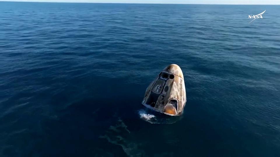 The Crew Dragon Capsule with Butch Wilmore and Suni Williams and two other astronauts floats after their Splashdown after their return to Earth from the international space station off the Florida coast on Wednesday in a stationary image of video.