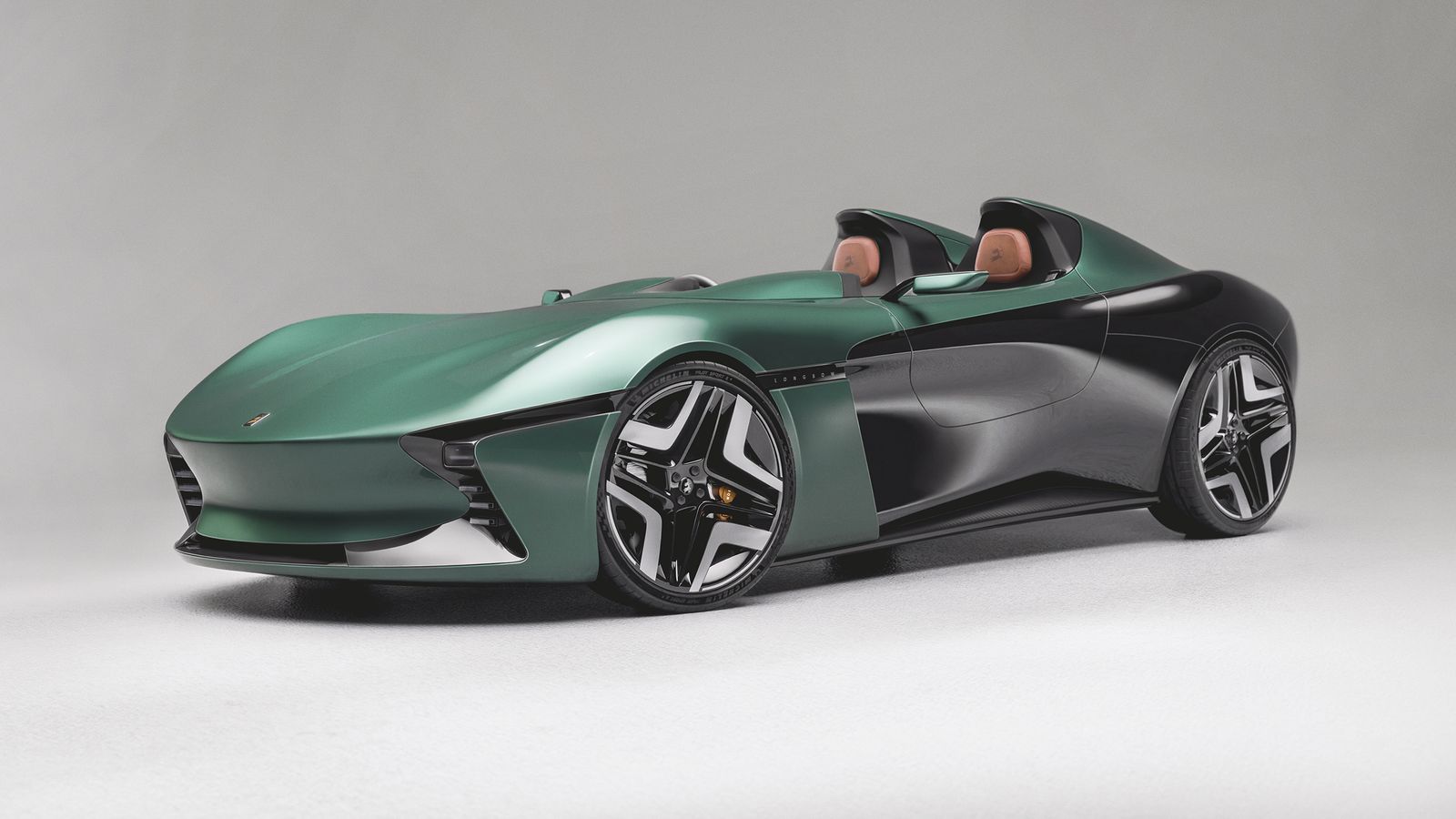 Side view of Longbow Featherweight Speedster A green car with subtle turns and chairs exposed by the lack of a hard top.