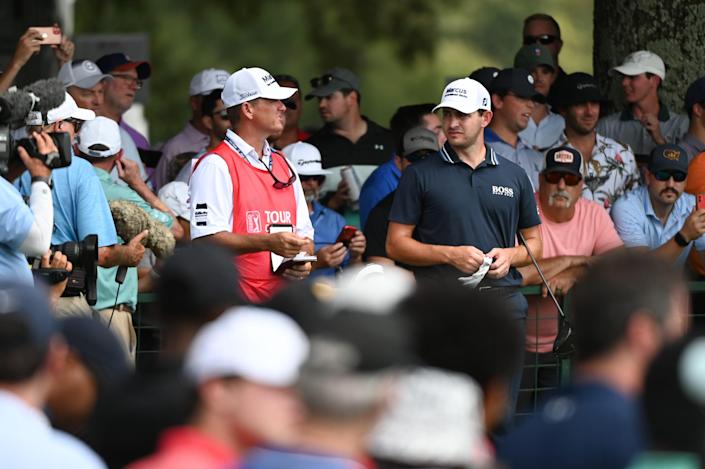 September 5, 2021;  Atlanta, Georgia, USA;  Patrick Cantlay talks to his caddy Matthew Minister on hole 10 during the final round of the Tour Championship golf tournament.  Mandatory credit: Adam Hagy-USA TODAY Sports