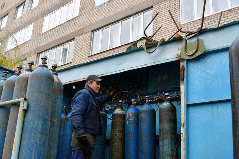 In Kramatorsk City Hospital, an employee is seen servicing oxygen cylinders for COVID-19 patients. 