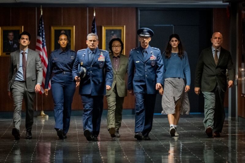 (lr) Ben Schwartz as Tony Scarapiducci;  Tawny Newsome as Angela Ali;  Steve Carell as General Mark Naird;  Jimmy O. Yang as Dr.  Chan Kaifang;  Don Lake as Brigadier General Bradley Gregory;  Diana Silvers as Erin Naird;  and John Malkovich as Dr.  Adrian Mallory.