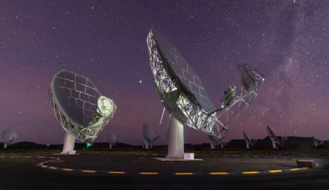 Fifteen of the 64 dishes of the MeerKAT radio telescope under a star-filled sky in the Karoo, South Africa. 