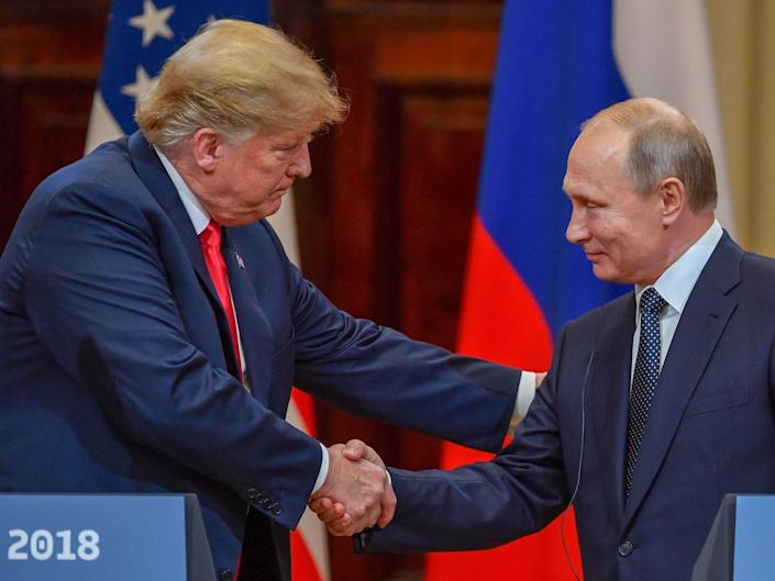 Former President Donald Trump and Russian President Vladimir Putin shake hands in Helsinki, Finland on July 16, 2018.