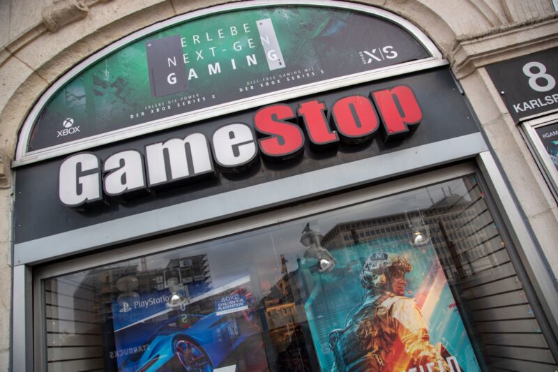 The GameStop logo above the door leading to a GameStop store in Munich.