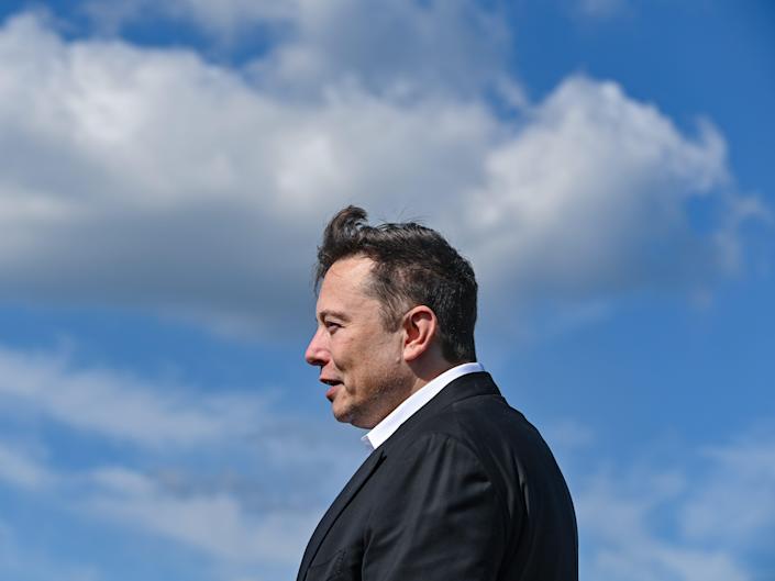 Elon Musk, head of Tesla, stands on the construction site of the Tesla Gigafactory.