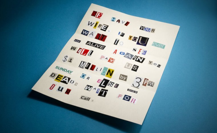 Stock photo of ransom note with letters cut from newspaper and magazine.