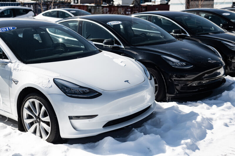 Used Tesla model 3 sedans for sale at an all-EV dealer.