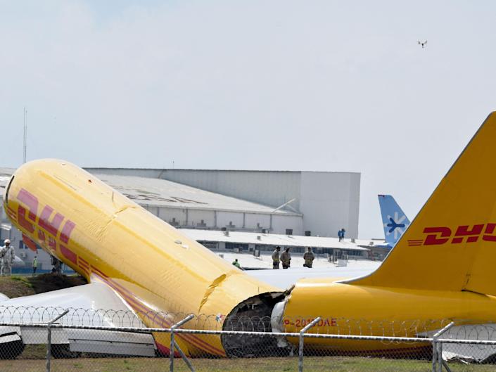 A DHL cargo plane is seen after an emergency landing at Juan Santa Maria International Airport due to a mechanical problem, in Alajuela, Costa Rica, on April 7, 2022.