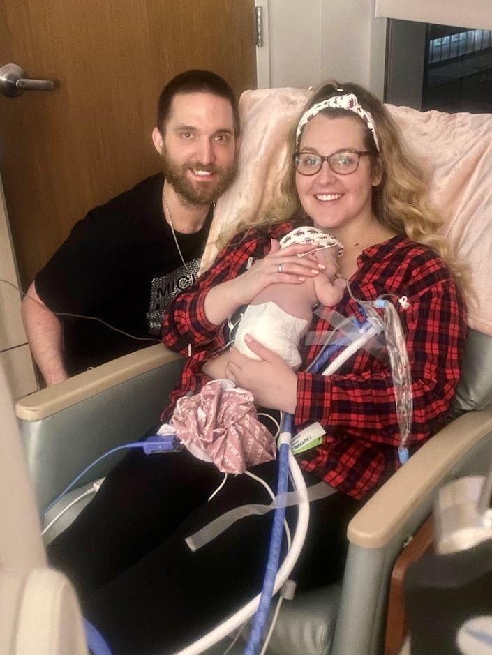 Cathy Soteropoulos, her husband, Kevin, and baby Nola spend time together on Christmas Eve at AdventHealth for Children in Orlando.