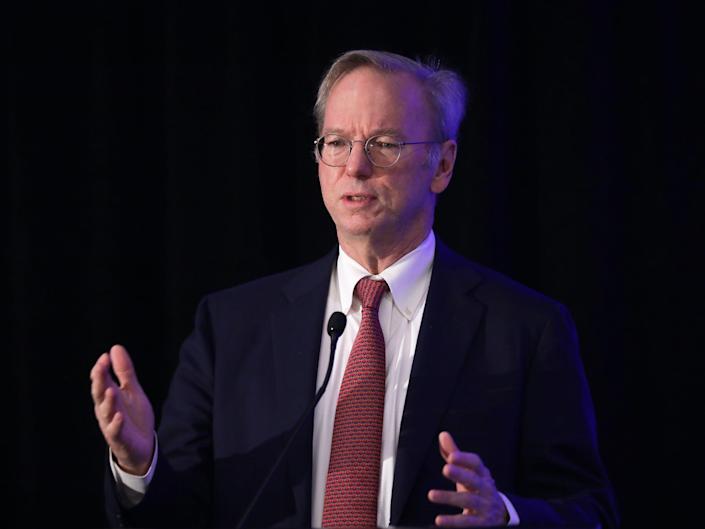 Eric Schmidt, former CEO of Google, gestures as he speaks on stage