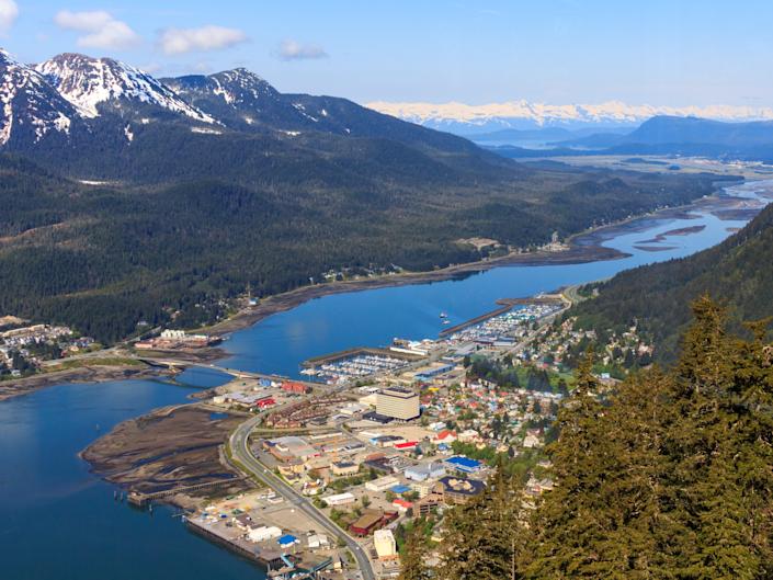 An aerial view of Anchorage Alaska with mountains and waterways