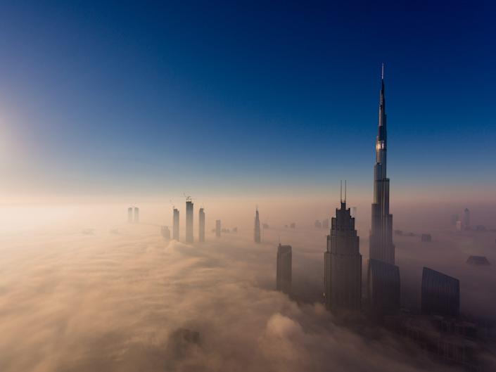 The Burj Khalifa rises high above the clouds in Dubai.