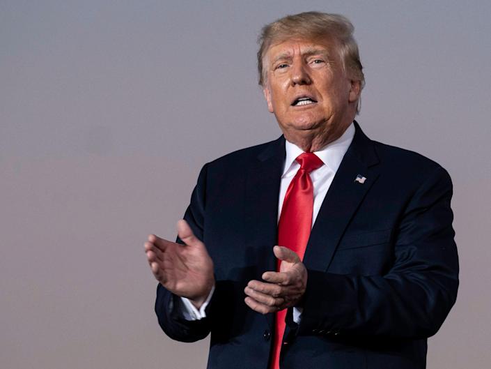 Former President Donald Trump prepares to take the stage at a rally in Perry, Georgia, on September 25, 2021.