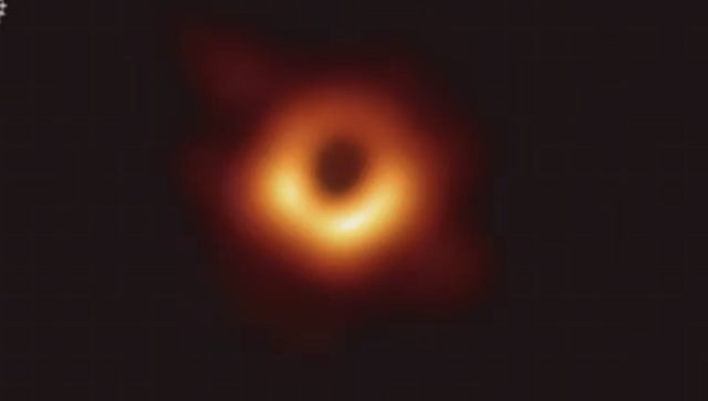 The first image of the environment around a black hole, taken by the Event Horizon Telescope collaboration in 2019. It's not all dark, by the way.