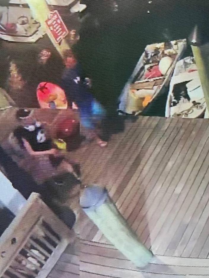 Security camera footage shows a woman who, according to US Coast Guard, is Jewel Hammond exiting the Schooner's Wharf Bar in Key West on Wednesday, May 11, 2022.