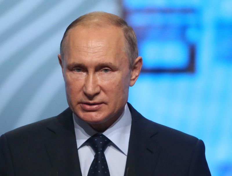 Russian President Vladimir Putin speaks at a forum.