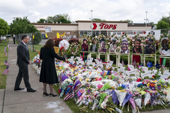 Vice President Kamala Harris and her husband, Doug Emhoff, pay their respects at a memorial to the victims of the Buffalo mass shooting