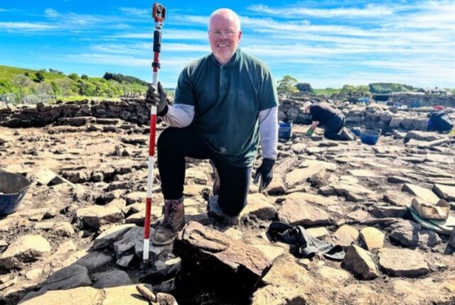 Retired biochemist Dylan Herbert was volunteering at the dig site when he came across the carved stone.