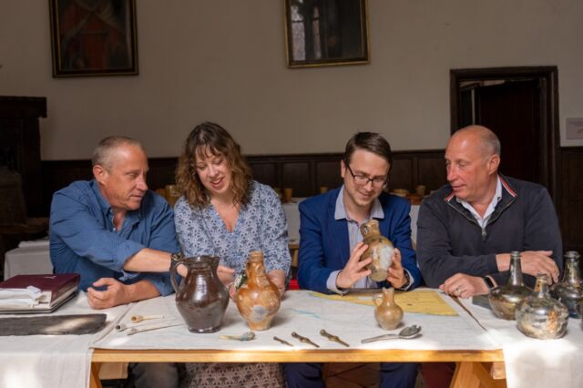 (LR) Lincoln Barnwell, Claire Jowitt (UEA), Benjamin Redding (UEA) and Julian Barnwell examine some of the artifacts found in the shipwreck.