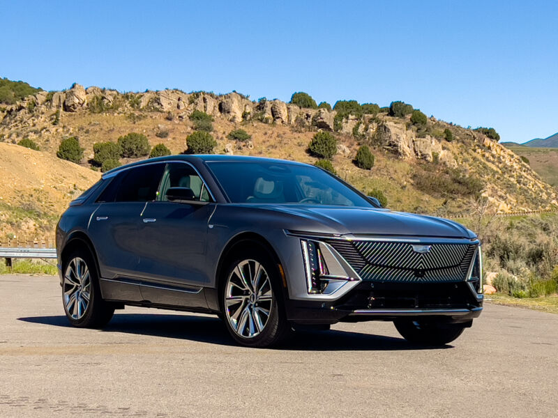 A Cadillac Lyriq parked in front of part of the Utah landscape.