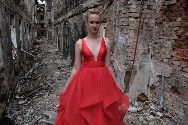 KHARKIV, UKRAINE - JUNE 7: A student wearing her prom dress poses for a photo among the ruins of her school destroyed by Russian shelling on June 7, 2022 in Kharkiv, Ukraine.  Teens in their prom gowns they would have worn staged a graduation ceremony in their devastated school.  (Photo by Abdullah Unver/Anadolu Agency via Getty Images) (Photo: Anadolu Agency via Getty Images)