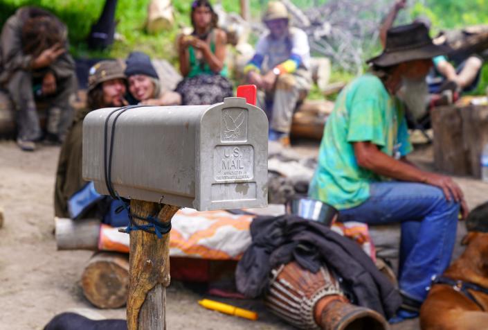 A mailbox filled with marijuana stands outside a camp at the Rainbow Family gathering on June 26.  Marijuana is legal in Colorado but prohibited in federal forest areas, so campers put the marijuana in the mailbox thinking only postal inspectors can open it without a warrant.