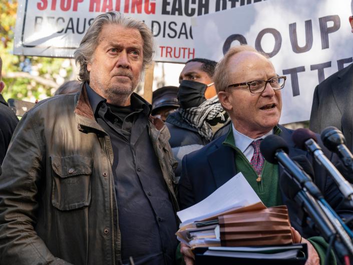 Former White House strategist Steve Bannon, center, and attorney David Schoen, right, pause to speak to reporters after the federal court's departure Monday, Nov. 15, 2021, in Washington