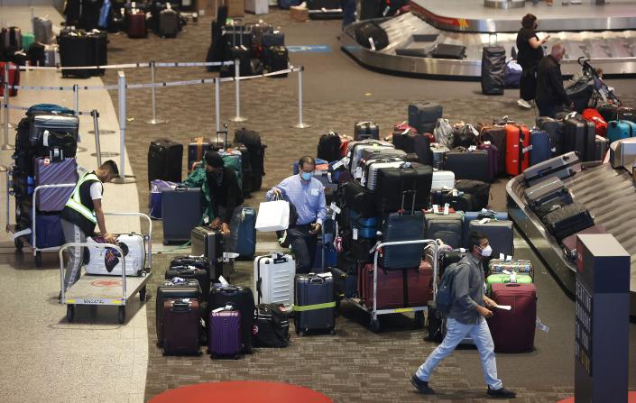 Baggage begins to pile up at Pearson International Airport on June 10, 2022.