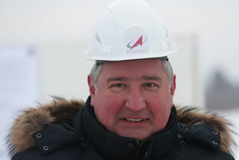 A warmly dressed man with a safety helmet.