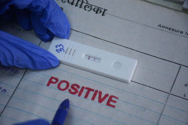 MUMBAI, INDIA JUNE 7: A health worker collects swabs from a citizen for Covid-19 testing after the number of cases increases in the city, at the testing center of TMC's CR Wadia Hospital, in Thane, on June 7, 2022 in Mumbai, India . 