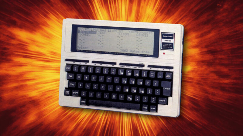 A 1983-era action hero TRS-80 Model 100 explodes onto the scene.