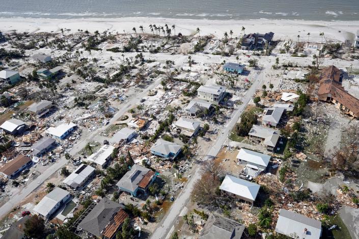 This aerial photo shows damaged homes and debris in the wake of Hurricane Ian, on Thursday, in Fort Myers, Florida.