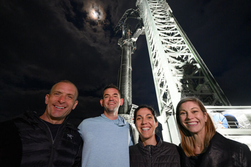 The crew of Polaris Dawn, from left: Scott Poteet, Jared Isaacman, Sarah Gillis and Anna Menon, pose in front of SpaceX's Super Heavy rocket in South Texas.