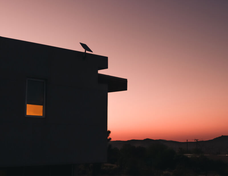 A Starlink satellite dish on top of a house.