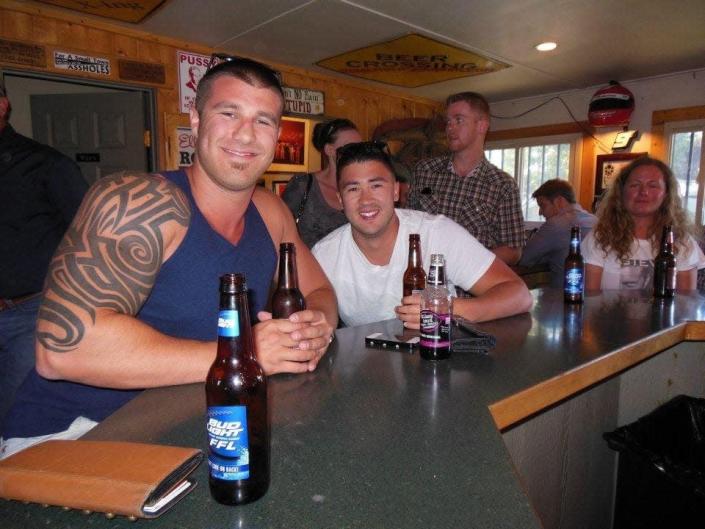 Scotty Pettersen (left) is pictured enjoying a beer.  Pettersens' parents hope his striking tattoo will evoke memories of those he helped save during the Las Vegas massacre in 2017.