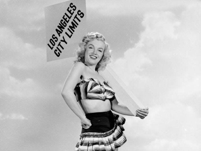 American movie star Marilyn Monroe (1926 - 1962) arrives at the city limits of Los Angeles, ready to take Hollywood by storm.