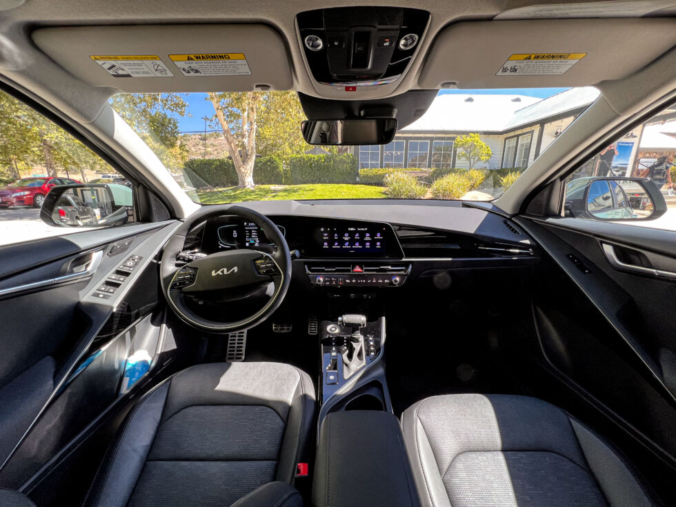 Niro's hybrid interior is firm and uncomplicated, but overloaded with piano black.