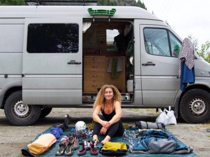 Kaya Lindsay in front of the van