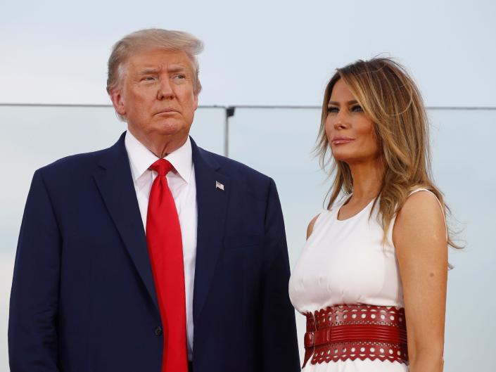 President Donald Trump and first lady Melania Trump take the stage during a "Salute to America"  event on the South Lawn of the White House, Saturday, July 4, 2020 in Washington.