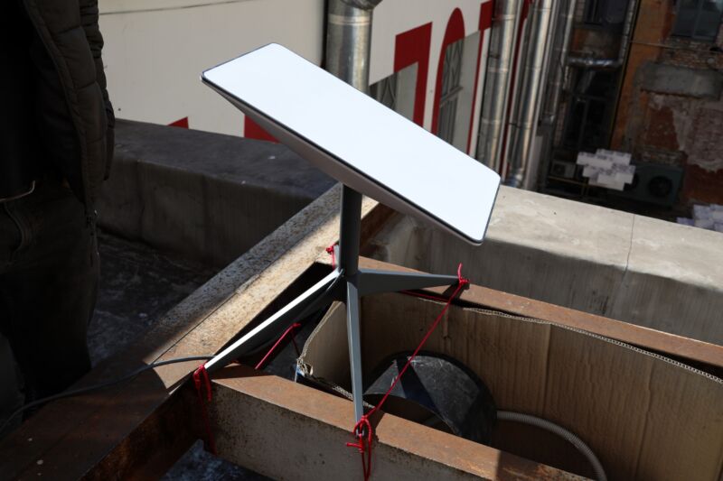 A satellite dish sits in a room.